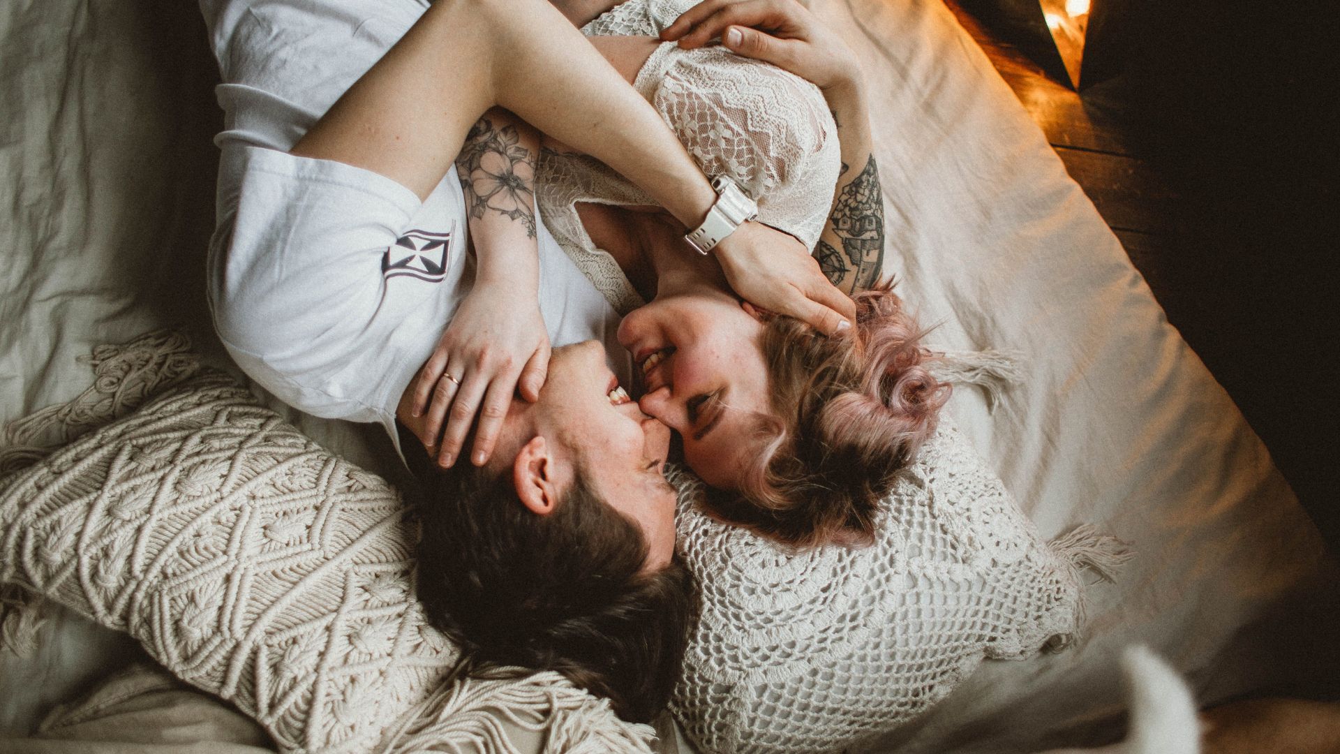 couple hugging on the bed